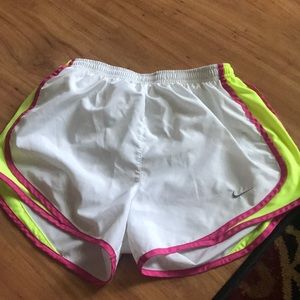 White Nike running shorts
